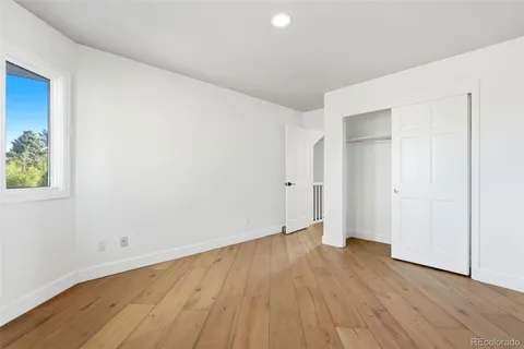 an empty room with wooden floor
