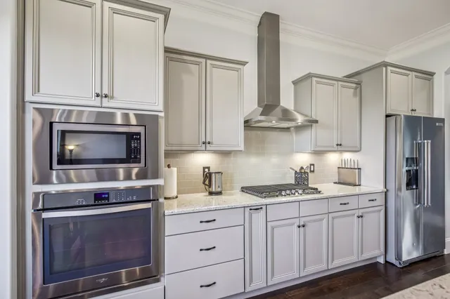 a view of walk in closet with clothes