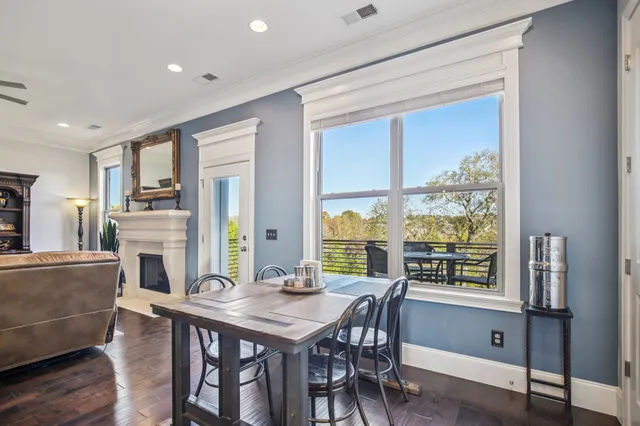 a view of a livingroom with furniture and a window