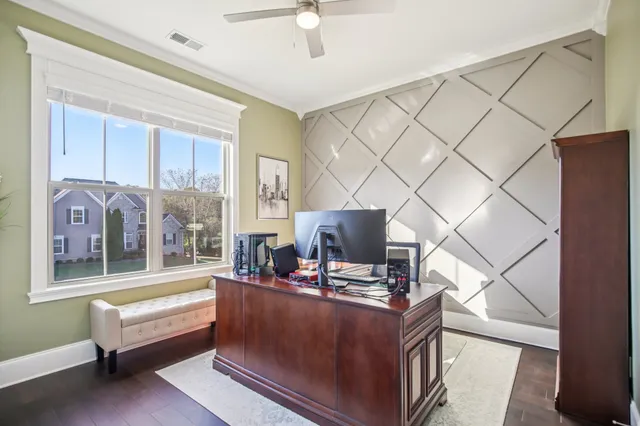 a utility room with dryer washer and a view of living room