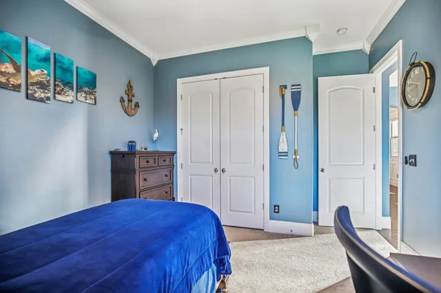 a view of a room with wooden floor and a porch