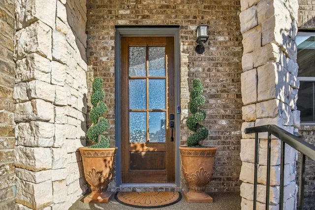 a kitchen with granite countertop a stove and cabinets