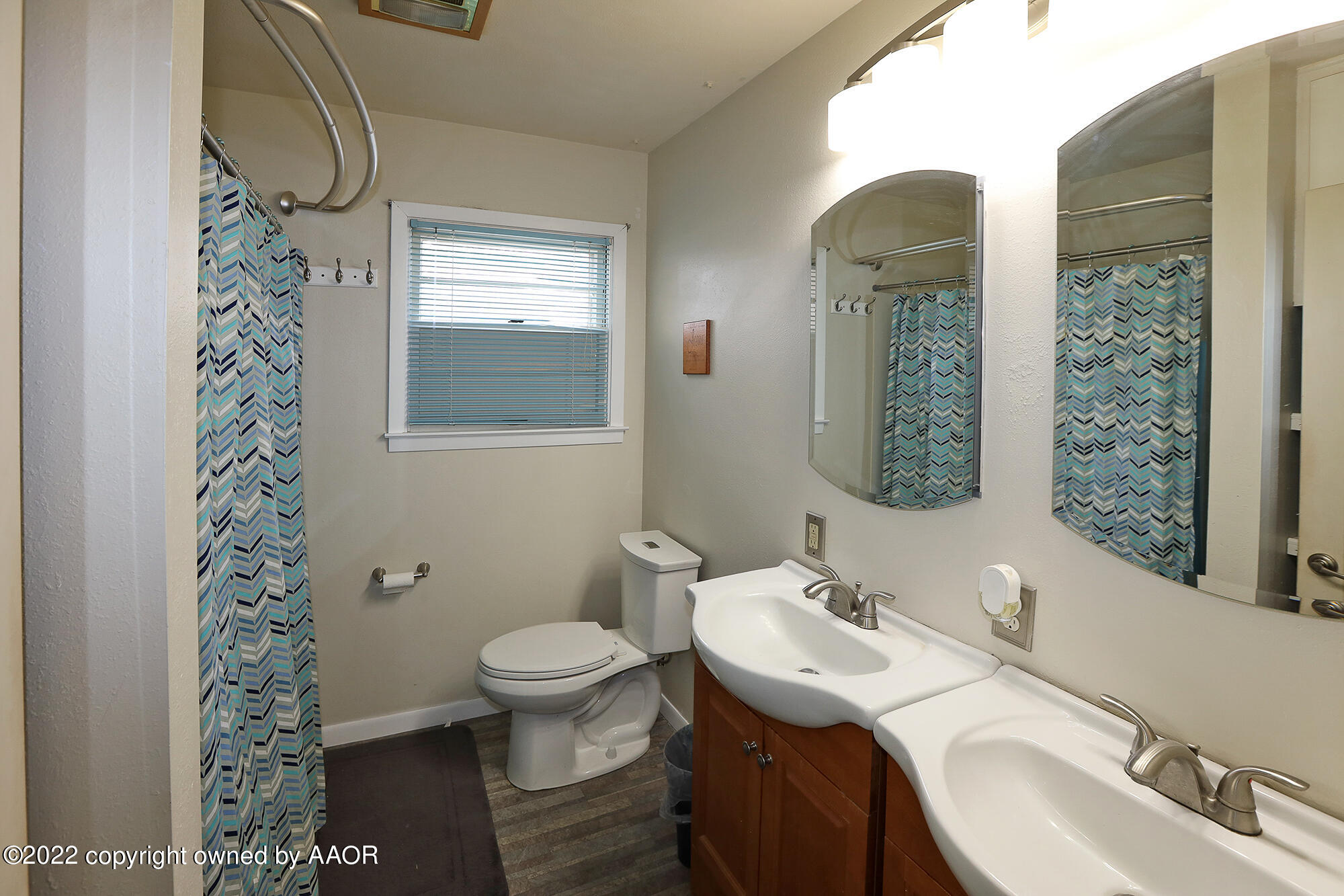 4318 South Hughes Street Amarillo, TX 79110 - Photo 13 of 25 a bathroom with a sink toilet and shower