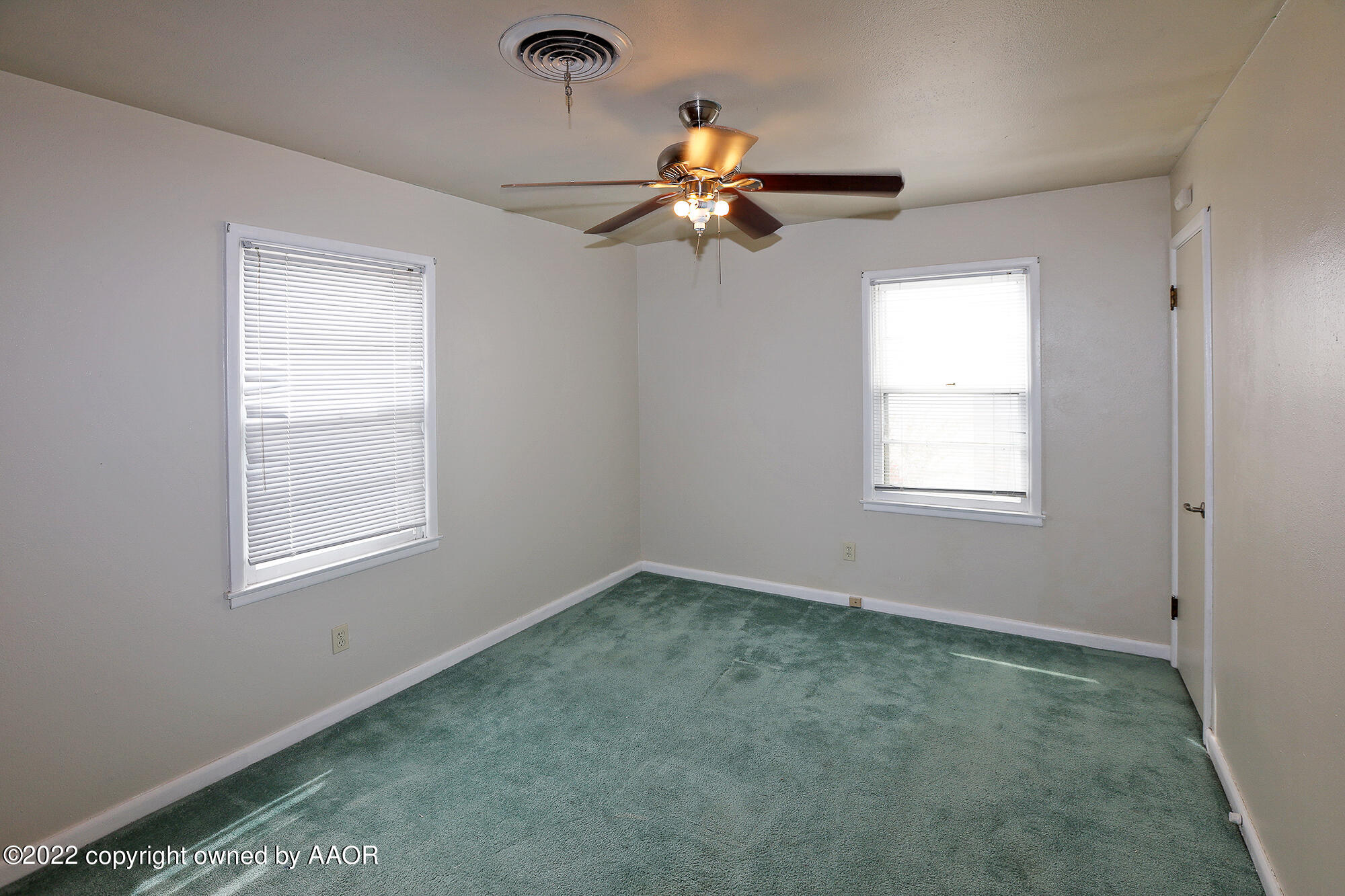 4318 South Hughes Street Amarillo, TX 79110 - Photo 16 of 25 an empty room with a window