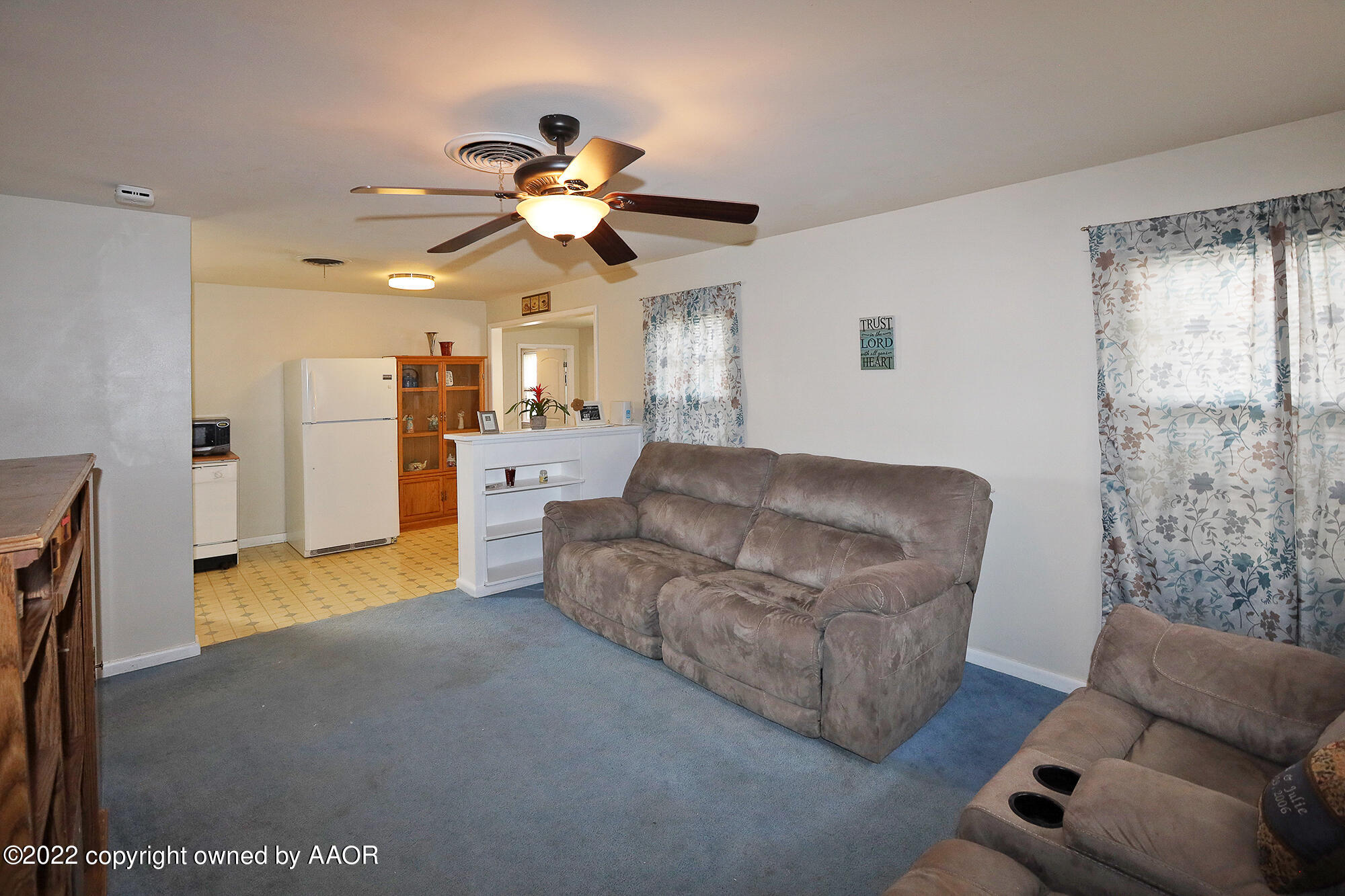 4318 South Hughes Street Amarillo, TX 79110 - Photo 2 of 25 a living room with furniture and a chandelier