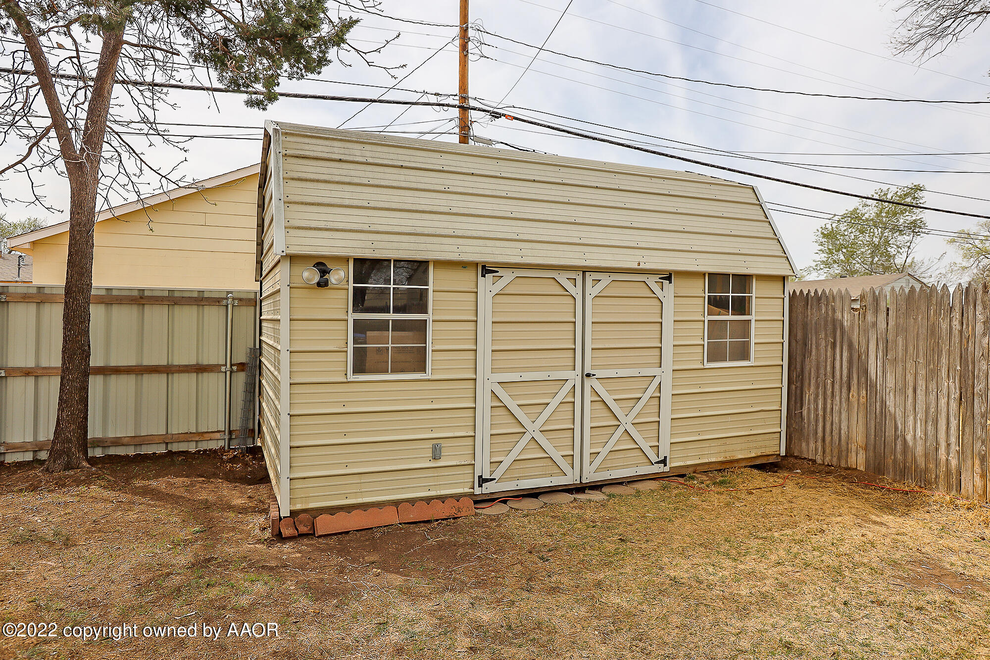 4318 South Hughes Street Amarillo, TX 79110 - Photo 25 of 25 a side view of a house with a garage