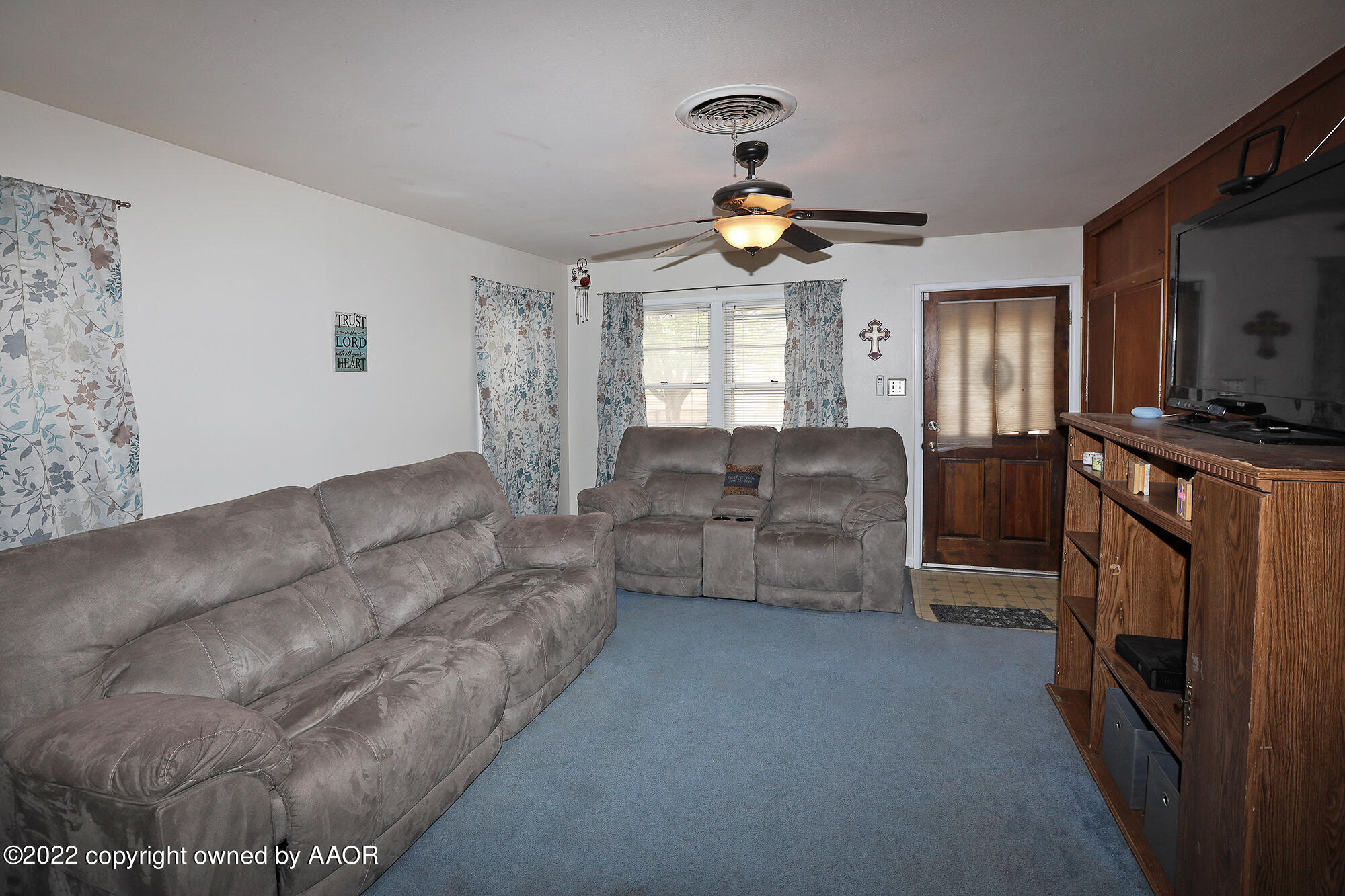 4318 South Hughes Street Amarillo, TX 79110 - Photo 3 of 25 a living room with furniture and a flat screen tv