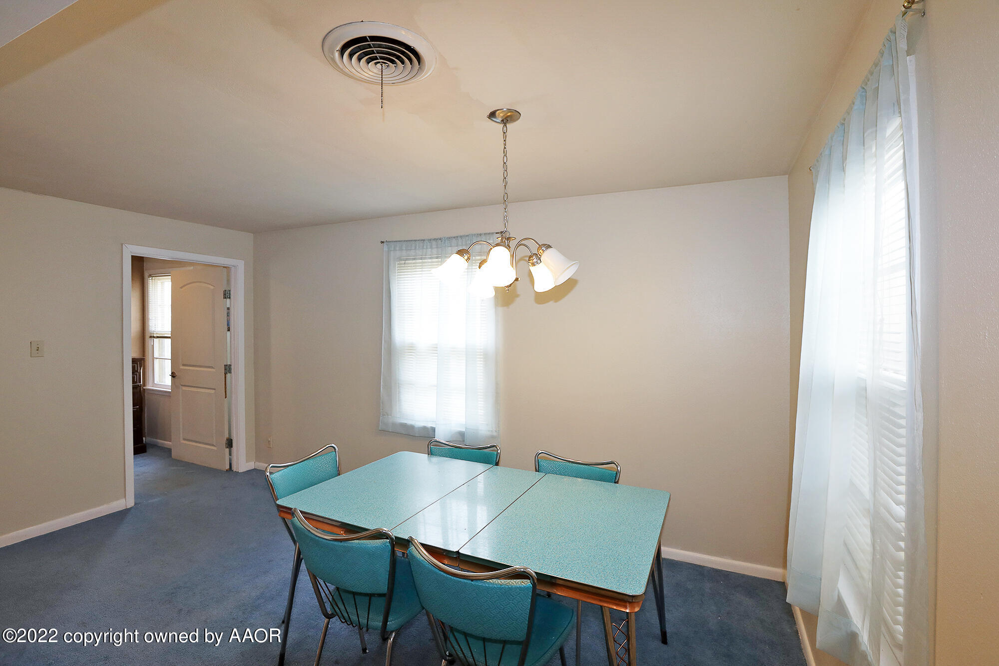 4318 South Hughes Street Amarillo, TX 79110 - Photo 4 of 25 a view of a dining room with furniture window and wooden floor