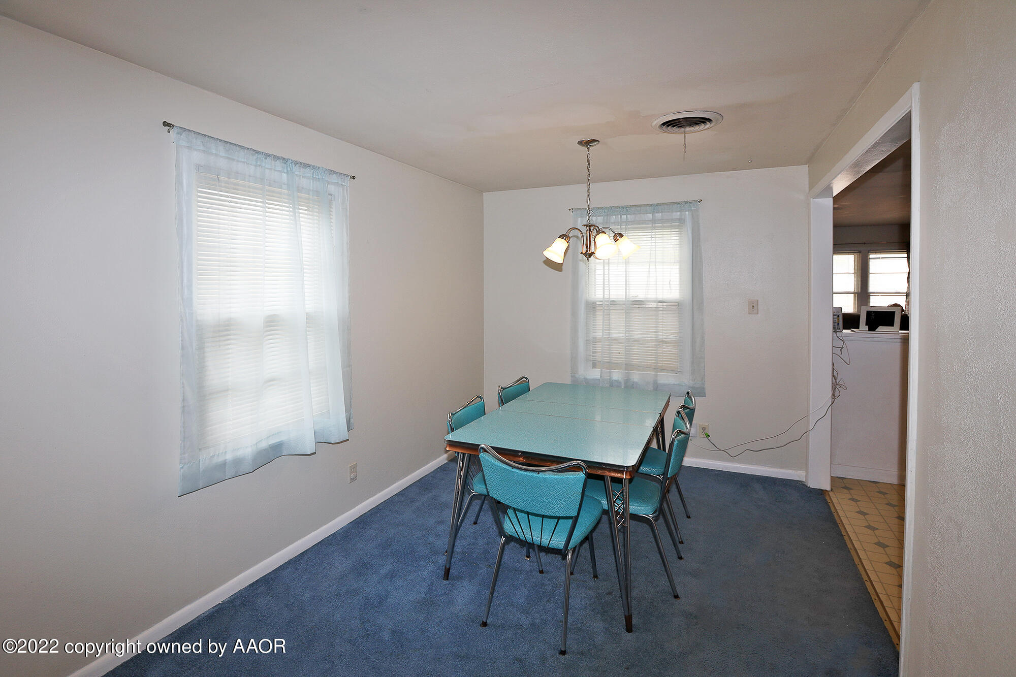 4318 South Hughes Street Amarillo, TX 79110 - Photo 5 of 25 a view of a dining room with furniture window and wooden floor