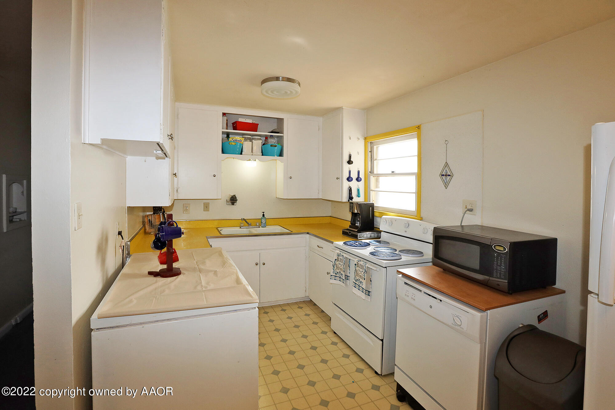 4318 South Hughes Street Amarillo, TX 79110 - Photo 7 of 25 a view of a kitchen with sink washer and dryer