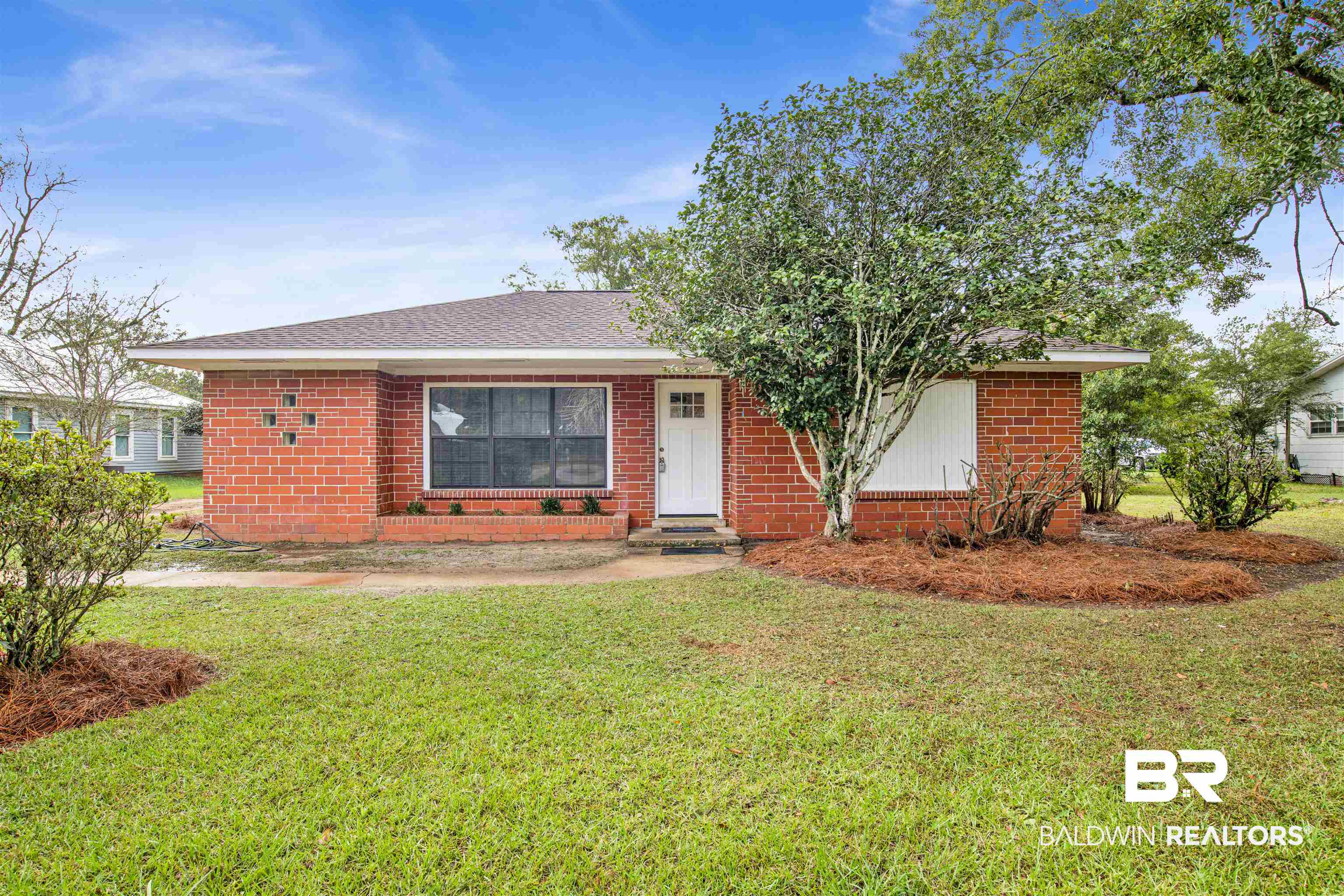 311 West Myrtle Avenue Foley, AL 36535 - Photo 1 of 22 View of front of house with a front yard
