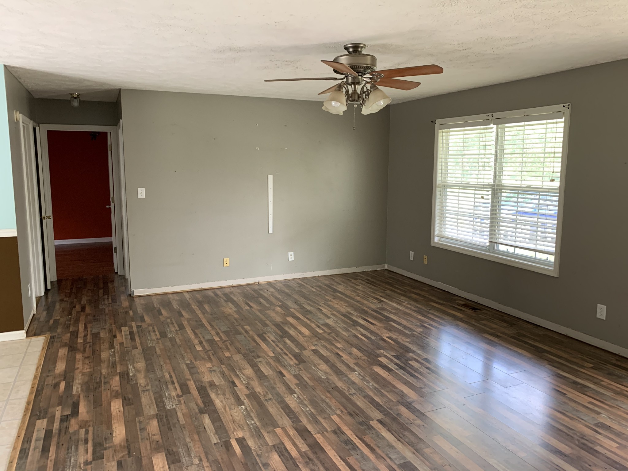 819 Hayes Road Lawrenceburg, TN 38464 - Photo 13 of 42 wooden floor in an empty room with a window