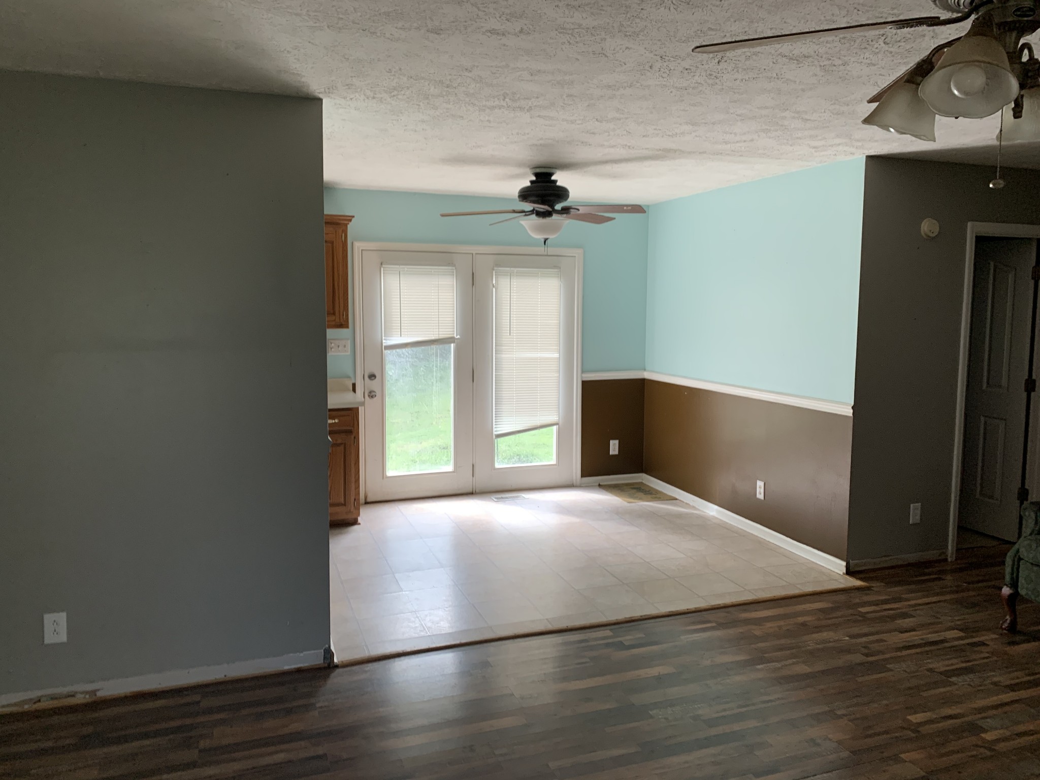 819 Hayes Road Lawrenceburg, TN 38464 - Photo 15 of 42 an empty room with wooden floor and windows