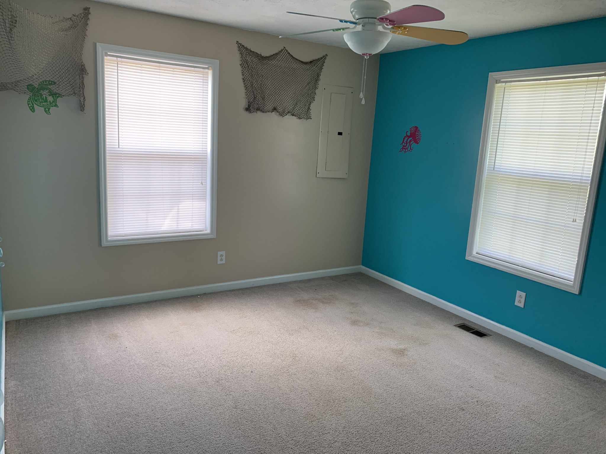 819 Hayes Road Lawrenceburg, TN 38464 - Photo 22 of 42 an empty room with a window and a fan