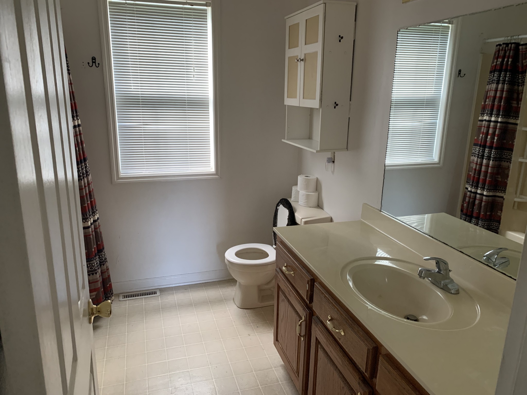 819 Hayes Road Lawrenceburg, TN 38464 - Photo 30 of 42 a bathroom with a sink toilet and mirror
