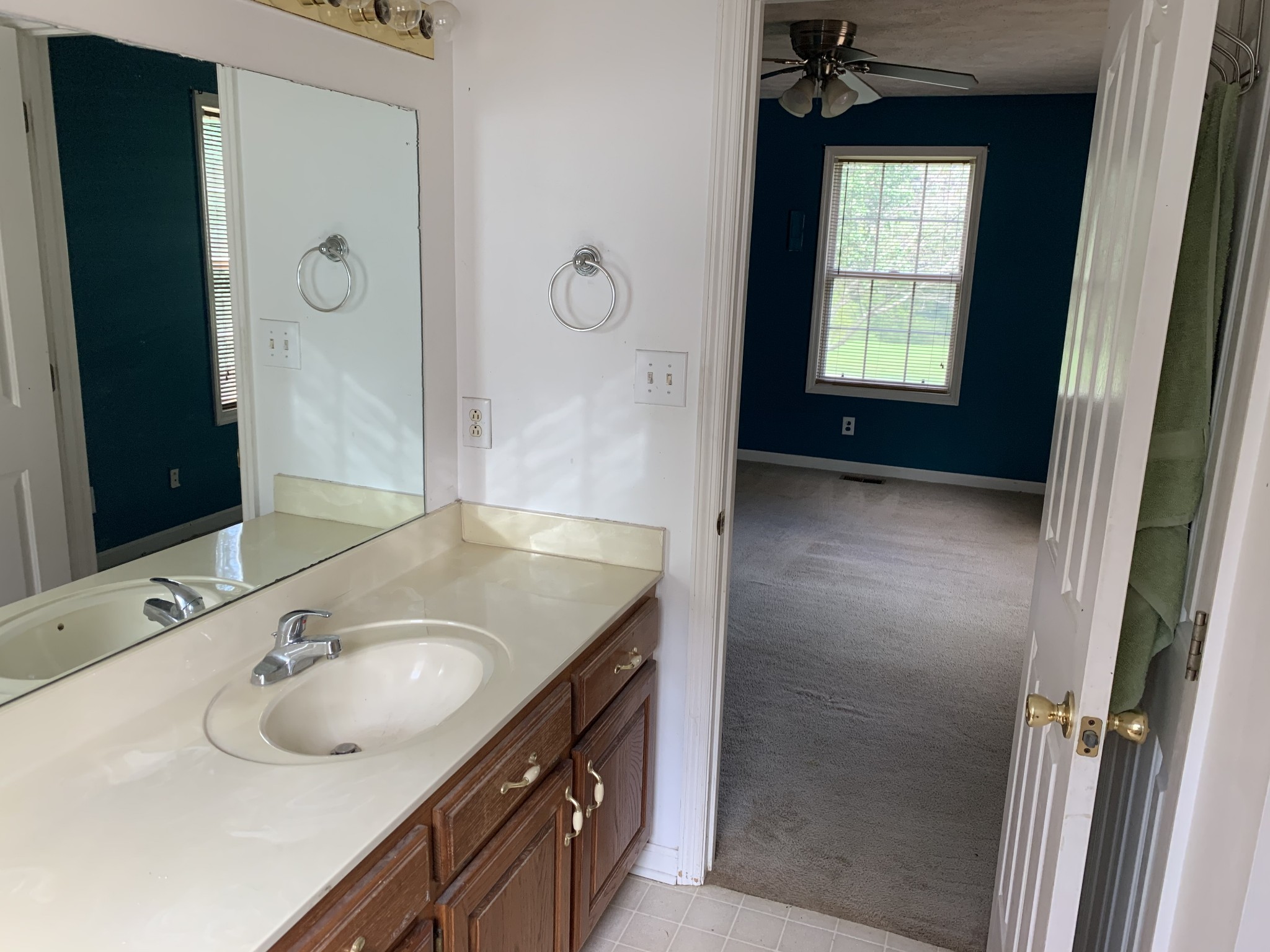 819 Hayes Road Lawrenceburg, TN 38464 - Photo 32 of 42 a bathroom with a granite countertop sink and a mirror
