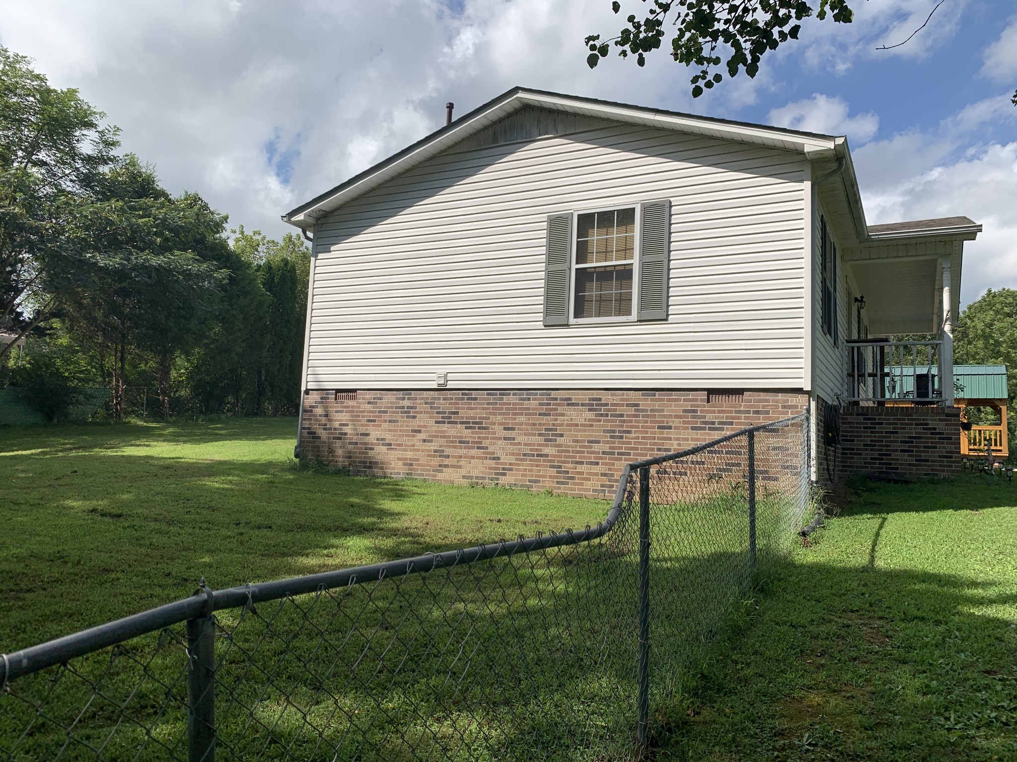 819 Hayes Road Lawrenceburg, TN 38464 - Photo 37 of 42 a view of backyard with a garden and plants