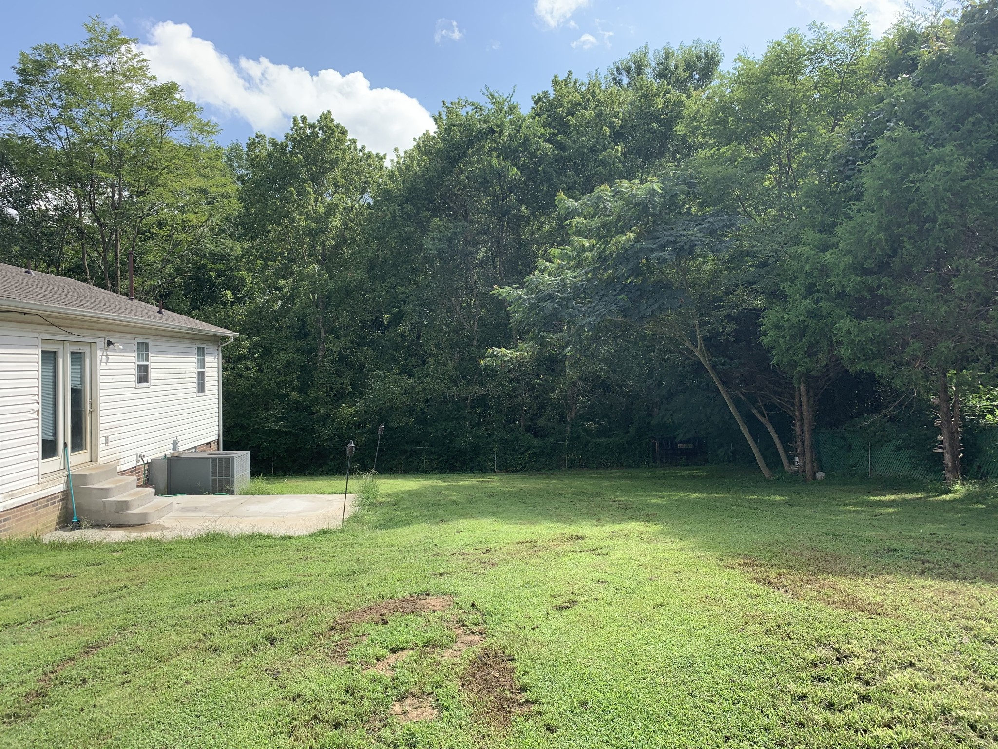 819 Hayes Road Lawrenceburg, TN 38464 - Photo 6 of 42 a backyard of a house with lots of green space
