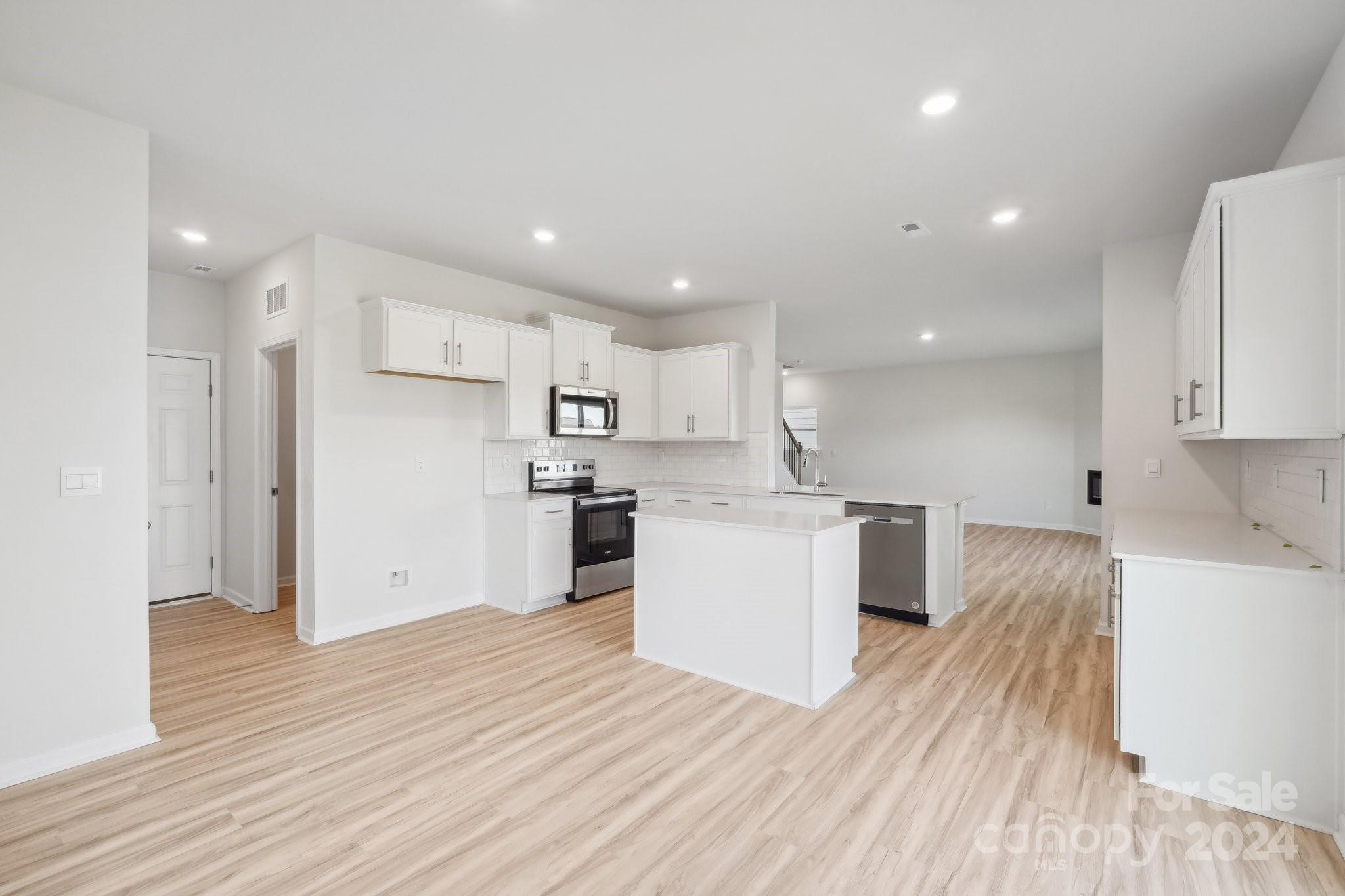 7914 Old Brk Road Sherrills Ford, NC 28673 - Photo 12 of 41 a kitchen with a white wooden cabinets and white stainless steel appliances