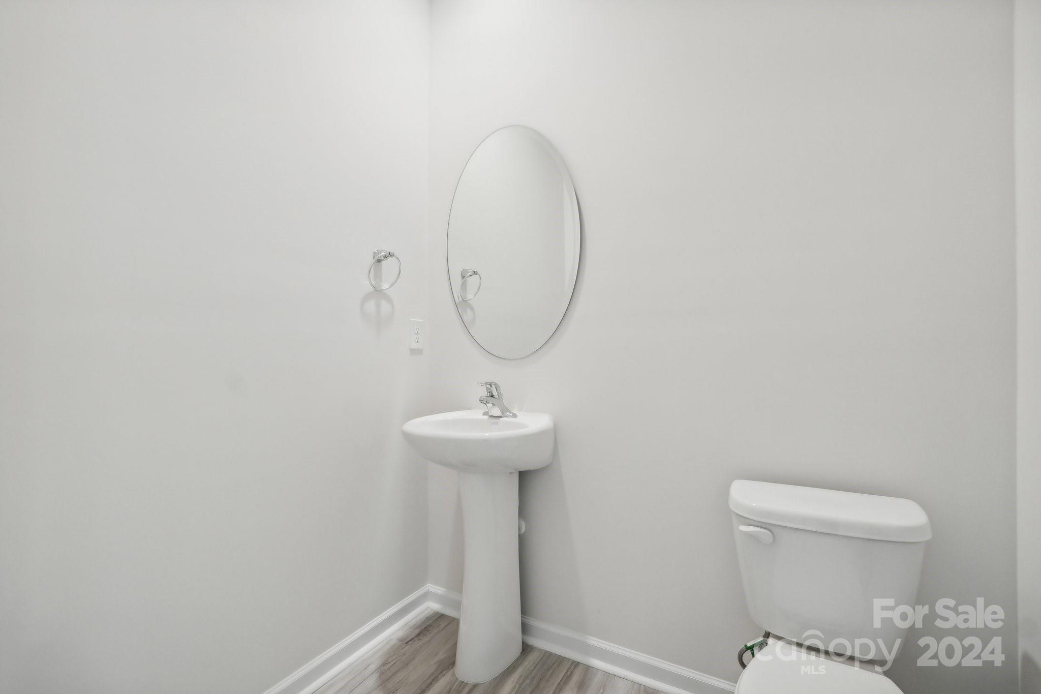 7914 Old Brk Road Sherrills Ford, NC 28673 - Photo 17 of 41 a bathroom with a sink a toilet and a mirror