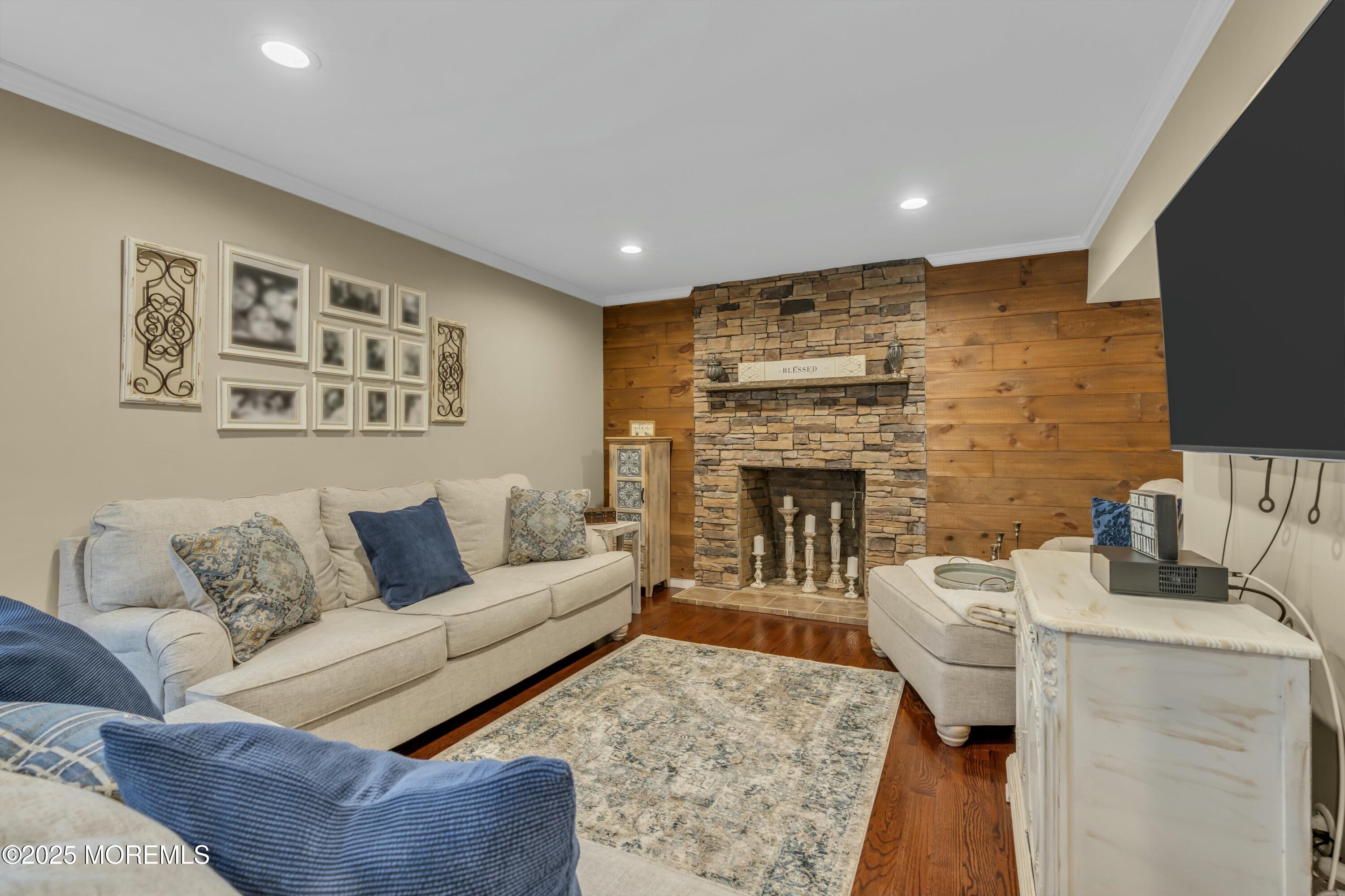 16 Glenarden Drive Howell, NJ 07731 - Photo 19 of 63 a living room with furniture and a fireplace