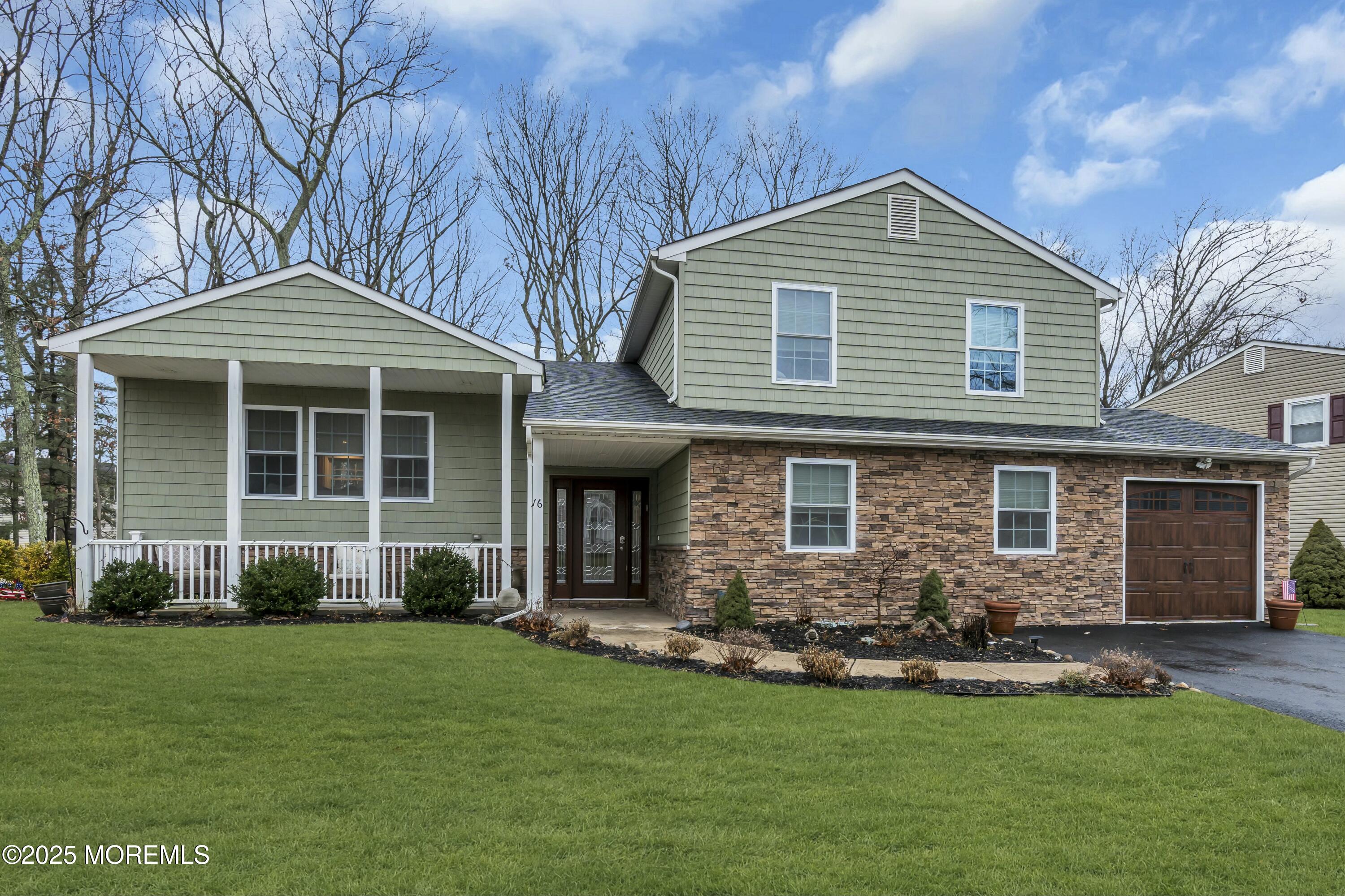 16 Glenarden Drive Howell, NJ 07731 - Photo 2 of 63 a front view of a house with a yard