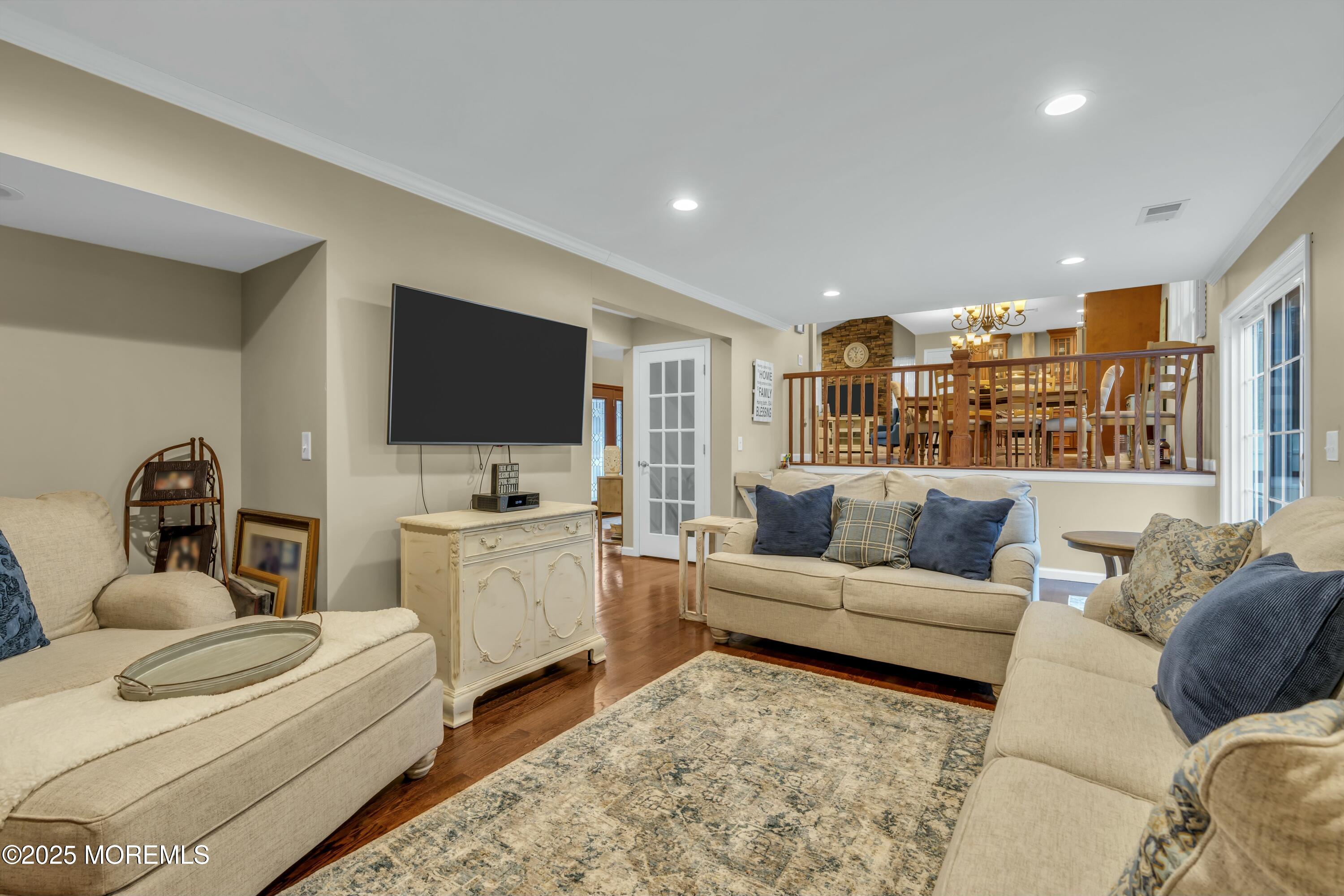 16 Glenarden Drive Howell, NJ 07731 - Photo 22 of 63 a living room with furniture and a flat screen tv
