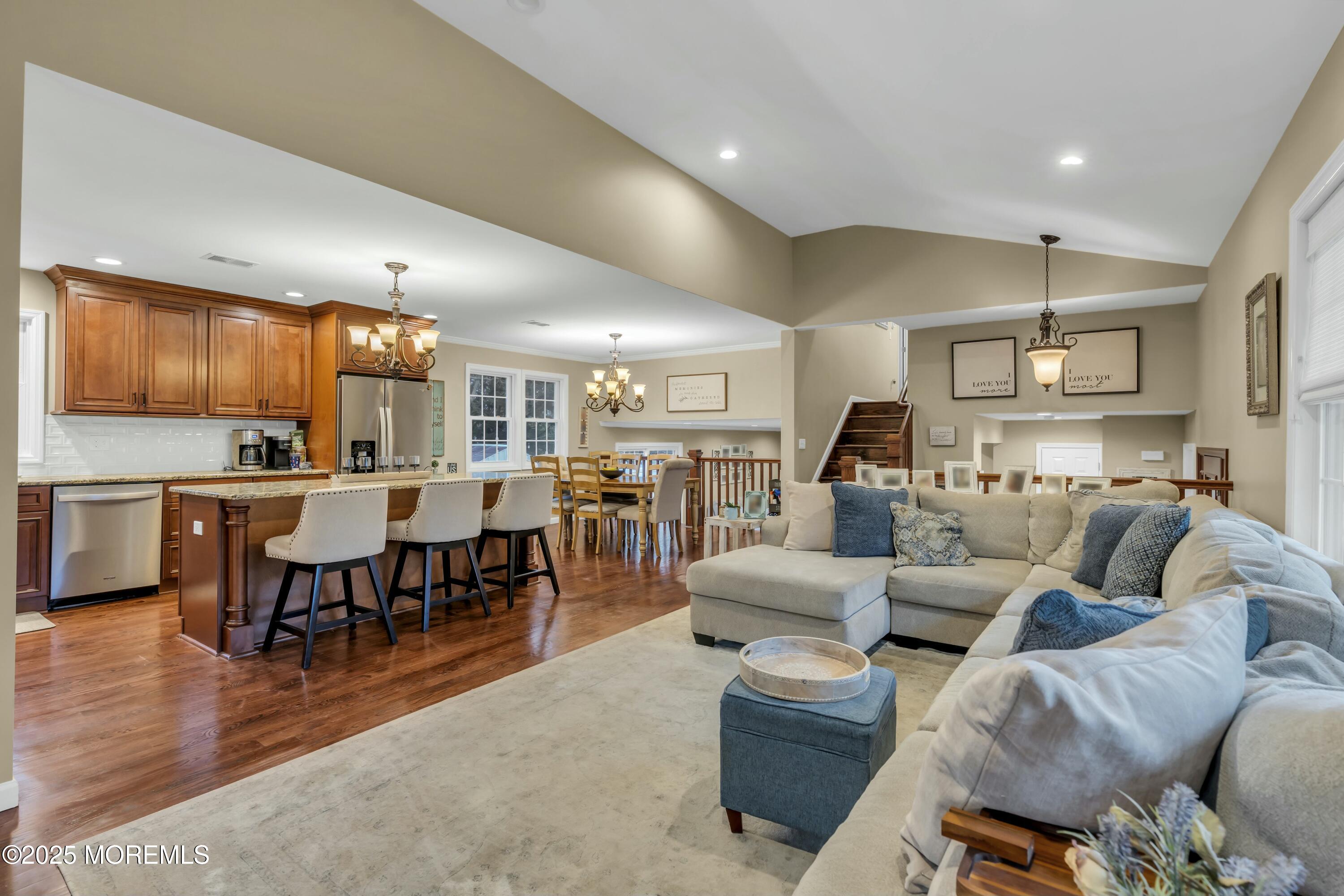 16 Glenarden Drive Howell, NJ 07731 - Photo 25 of 63 a living room with furniture kitchen view and a dining table