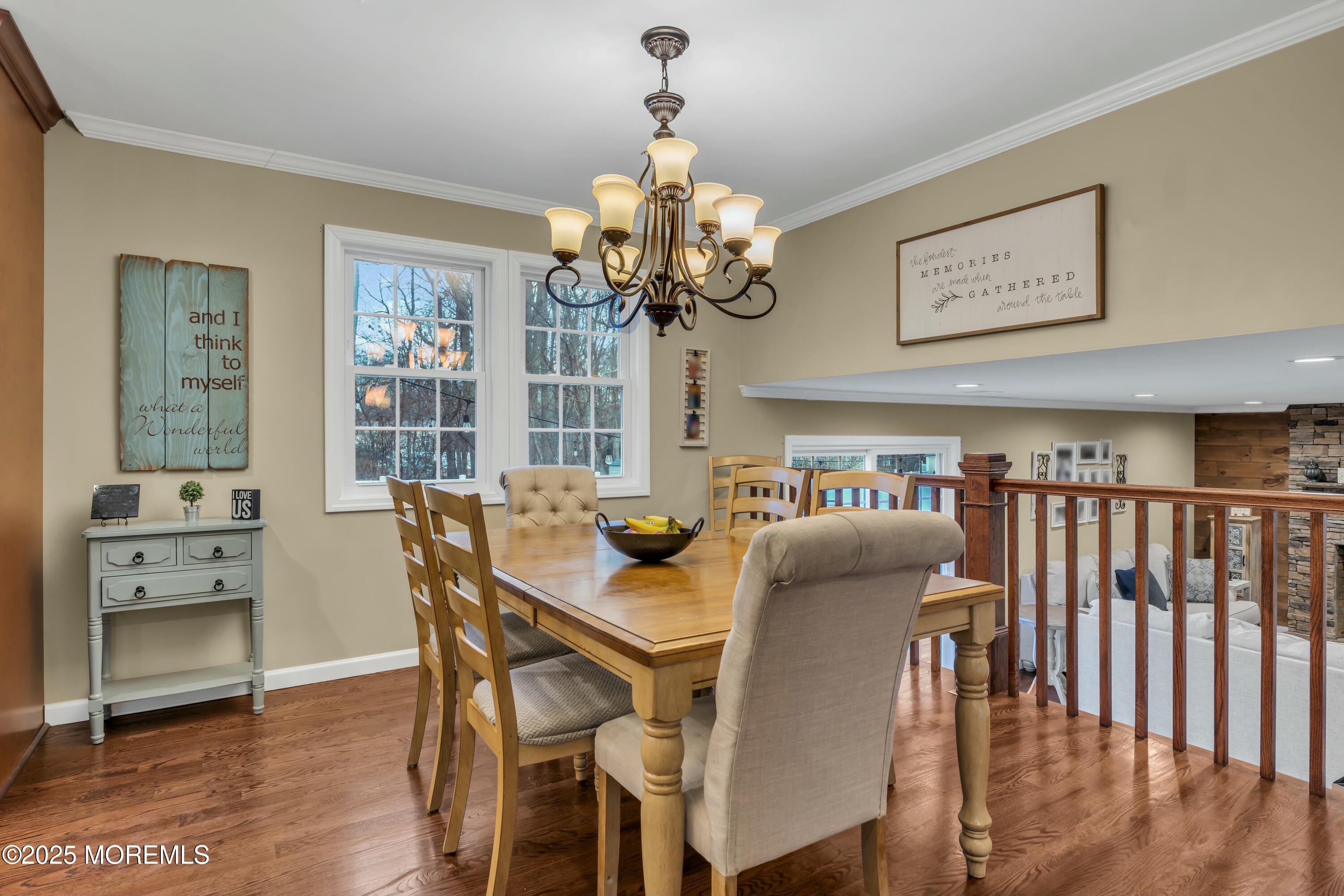 16 Glenarden Drive Howell, NJ 07731 - Photo 26 of 63 a dining room with furniture a chandelier and wooden floor
