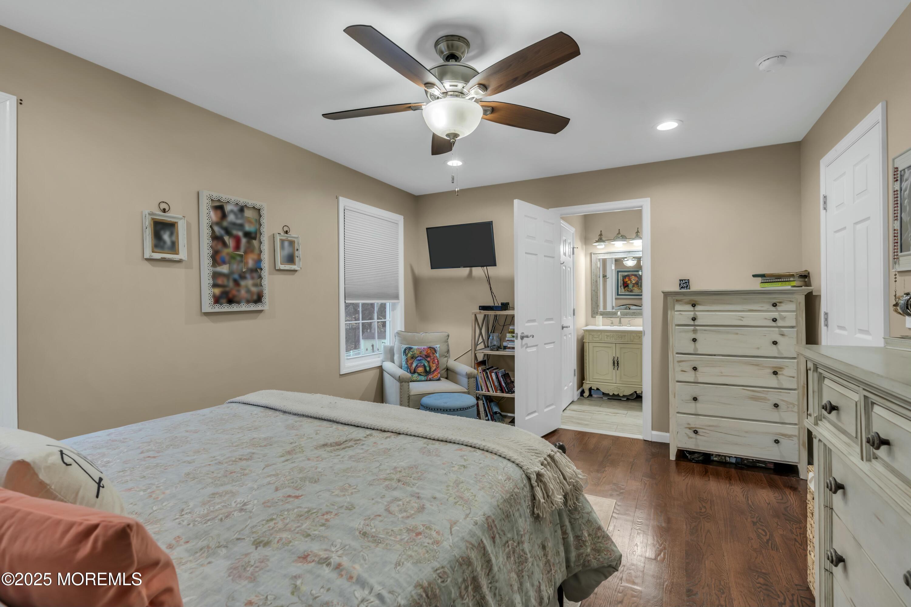 16 Glenarden Drive Howell, NJ 07731 - Photo 39 of 63 a bed room with a bed and a ceiling fan