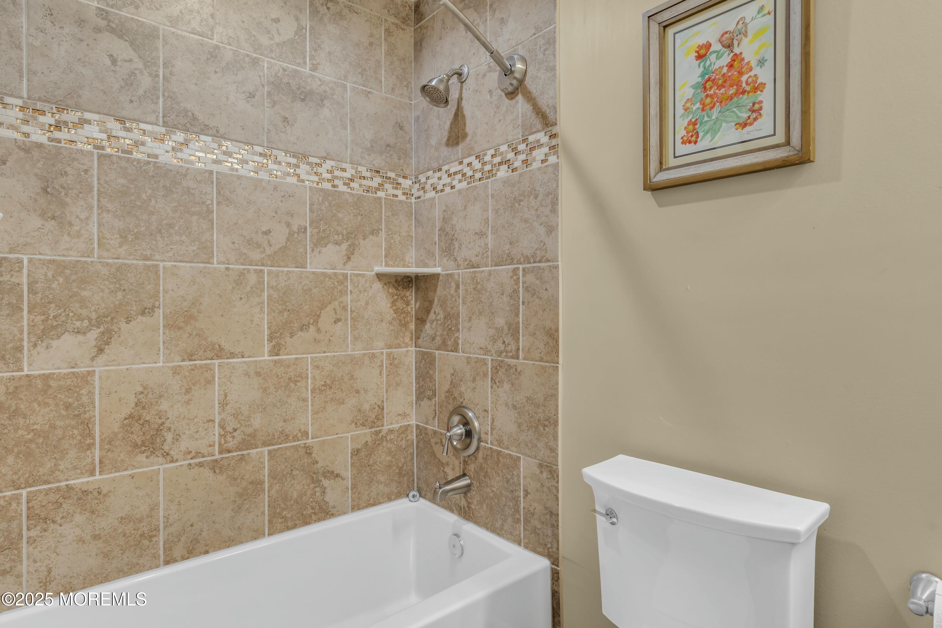 16 Glenarden Drive Howell, NJ 07731 - Photo 47 of 63 a bath tub sitting next to a white toilet