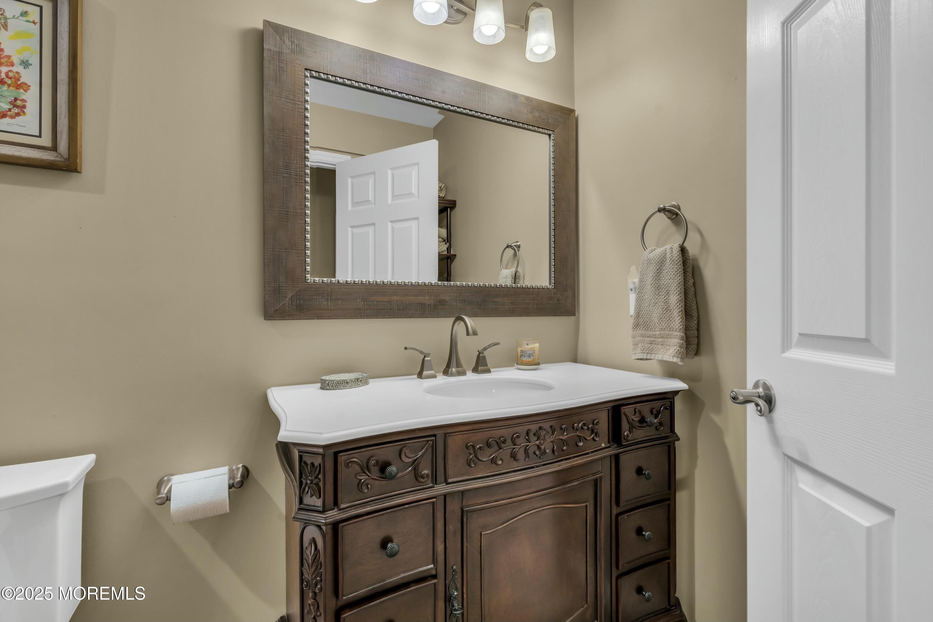 16 Glenarden Drive Howell, NJ 07731 - Photo 48 of 63 a bathroom with a sink and a mirror