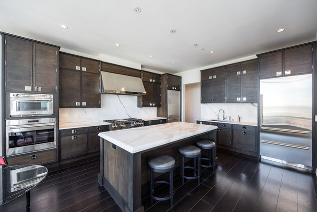 a kitchen with a stove a sink and a refrigerator