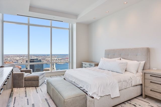 a bedroom with a bed and a night stand