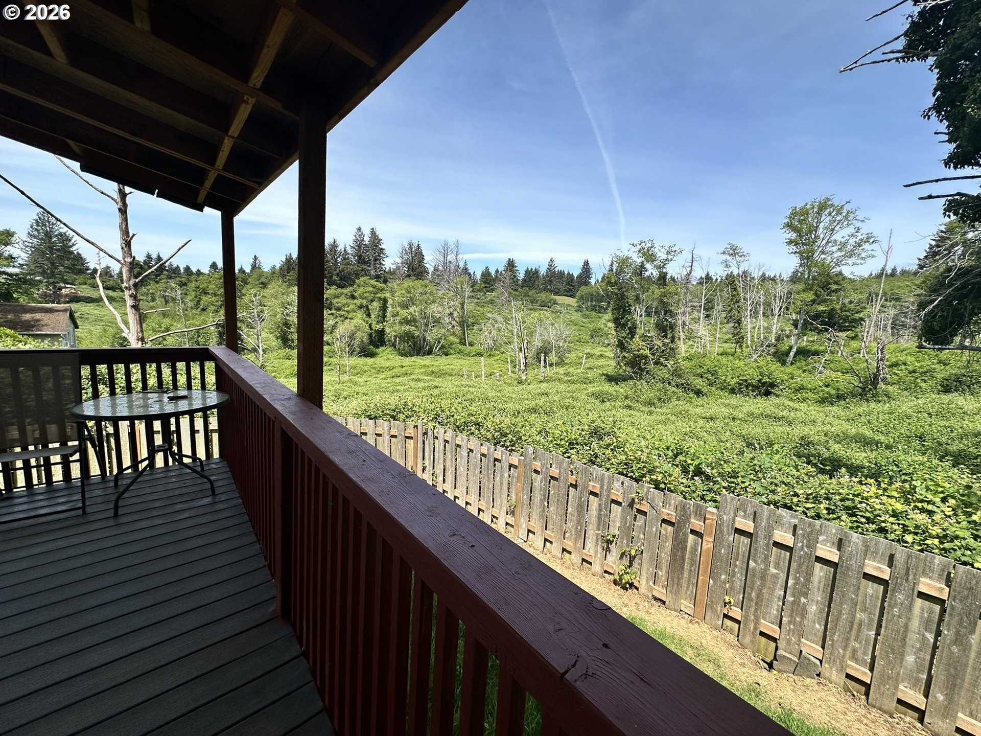 4821 Northeast 50th Street Neotsu, OR 97364 - Photo 16 of 19 a view of a deck with wooden floor and outer view
