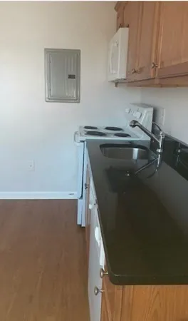 a kitchen with a sink and cabinets