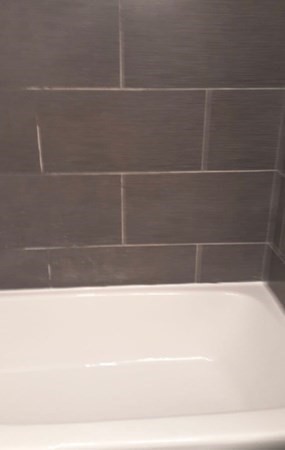 2 Granite Street, Unit 4 Malden, MA 02148 - Photo 4 of 6 a black and white photo of a bathtub