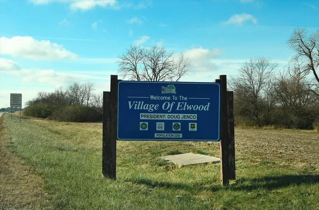 a swimming pool view with a outdoor seating