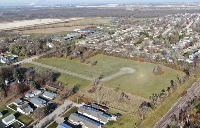 an aerial view of residential houses with outdoor space