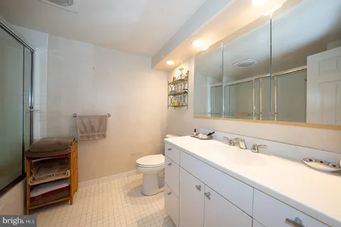 a bathroom with a sink toilet and vanity
