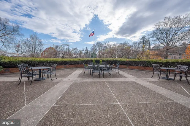 a patio with table and chairs