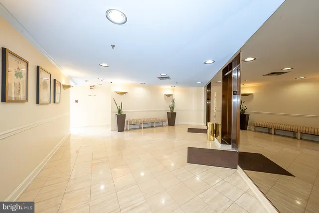 a lobby with a couch and a rug