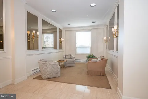 a living room with furniture and windows