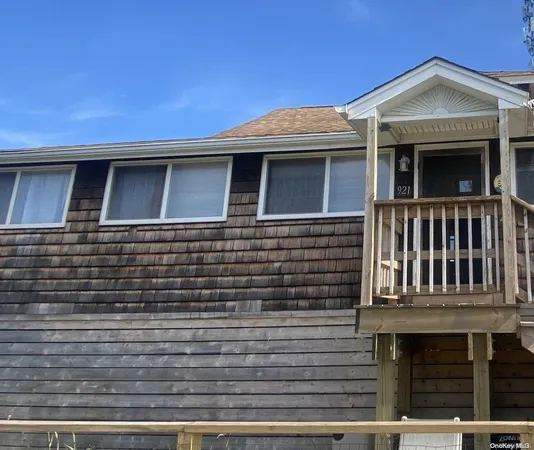 a front view of a house with glass windows