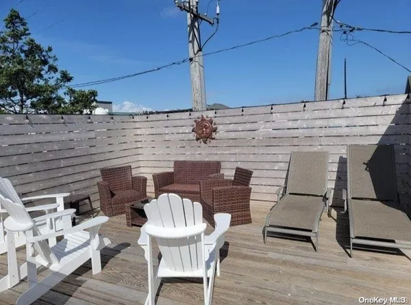 a patio with table and chairs