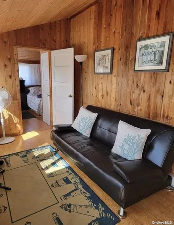 a living room with furniture and a rug