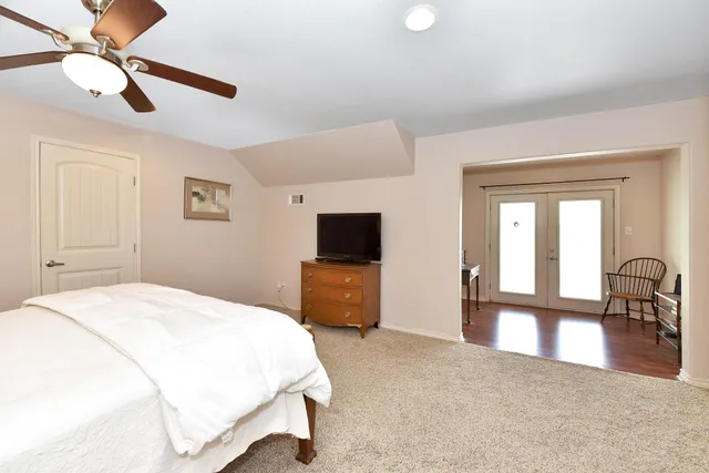 a view of a balcony with wooden floor and fence