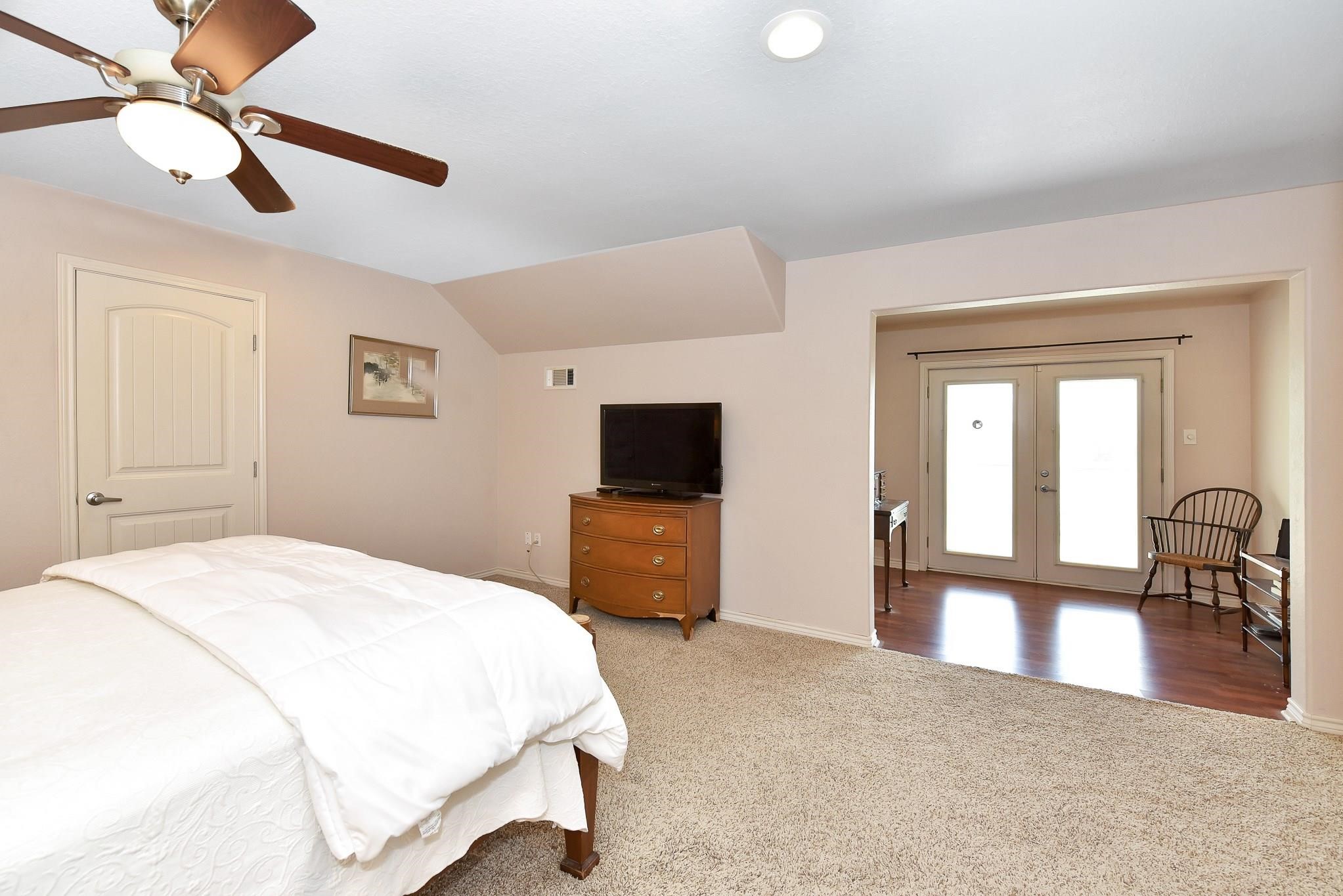 226 Valmar Kemah, TX 77565 - Photo 14 of 29 a bedroom with a bed and a flat screen tv