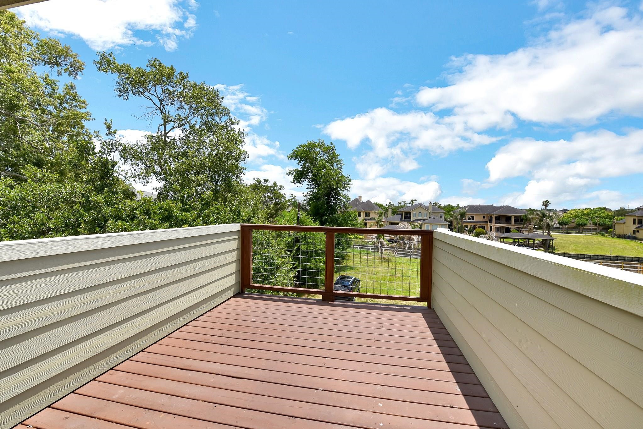 226 Valmar Kemah, TX 77565 - Photo 16 of 29 a view of a balcony with wooden floor and fence