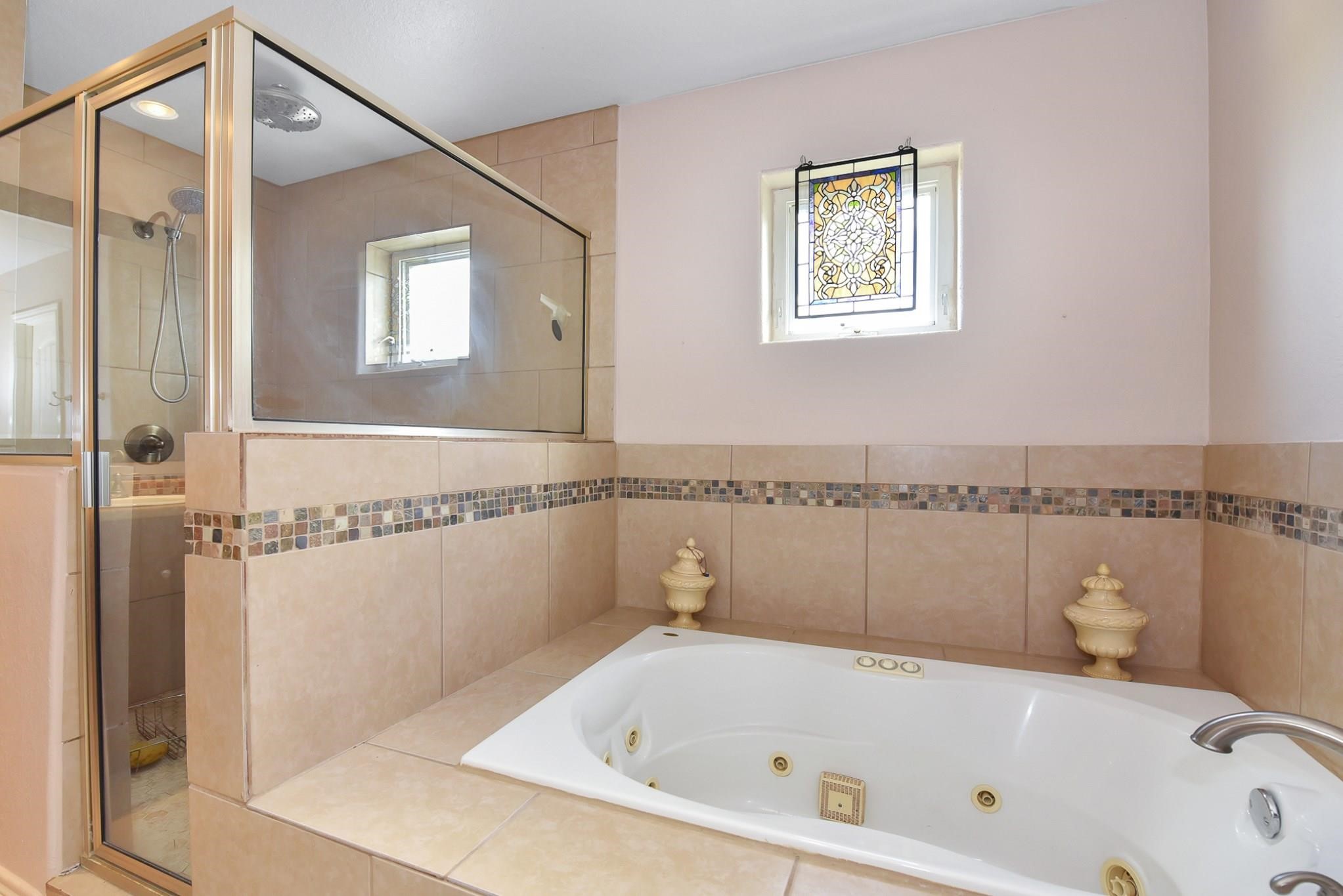 226 Valmar Kemah, TX 77565 - Photo 18 of 29 a bathroom with a bathtub and a shower